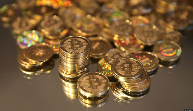 A pile of Bitcoins that were just made are arranged for a photograph in Sandy, Utah, U.S., on Friday, April 12, 2013. Created four years ago by a person or group using the name Satoshi Nakamoto, Bitcoin is a virtual currency that can be used to buy and sell a broad range of items -- from cupcakes to electronics to illegal narcotics. Photographer: George Frey/Bloomberg via Getty Images